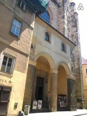 a large stone building with stairs and a tower at Old Town Center Just in 3 min Walk private room B in Prague