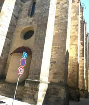 a clock tower with a bunch of signs on it at Old Town Center Just in 3 min Walk private room C in Prague