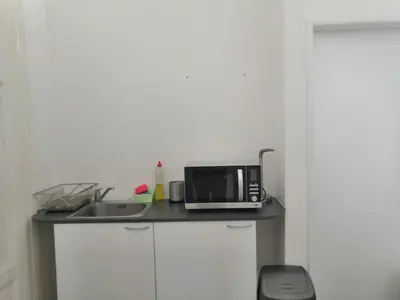 a kitchen counter with a microwave and a sink at Old Town Center Just in 3 min Walk private room C in Prague