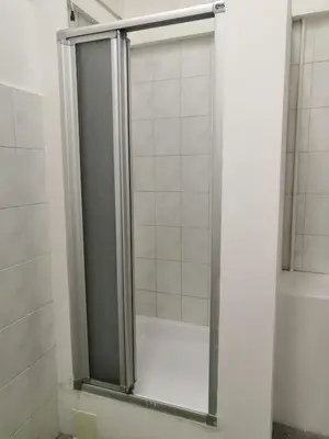 a shower with a glass door in a bathroom at Old Town Center Just in 3 min Walk private room D in Prague