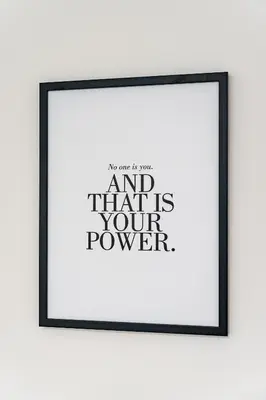 a framed picture of a poster with the text and that is your power at Elvis Deluxe Suite in Prague