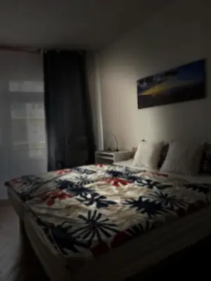 a bedroom with a bed with a colorful blanket at Downtown Prague in Prague