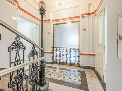 a hallway with a staircase and a screen in a building at Apartment Čelakovsky-1 by Interhome in Prague