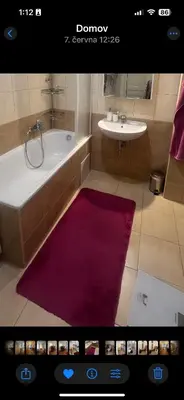 a bathroom with a bath tub and a sink at Štěpánká - Lucerna 1 in Prague