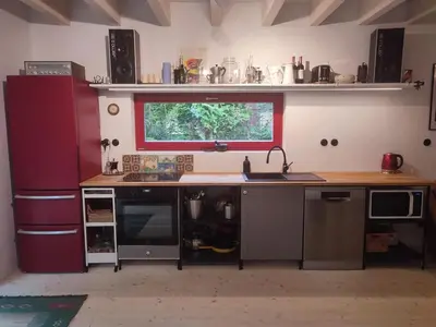 a kitchen with a counter with a sink and a window at Romantic cottage Slapy - Renovated