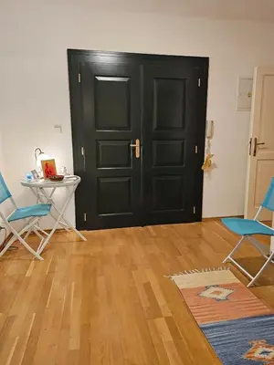 a room with a black door and two chairs and a table at 2 min Center Just In, Old Town Walk private room C in Prague