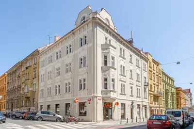 a large white building on the corner of a street at Blueground Holešovice view nr Vltava PRG-52 in Prague