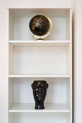 a shelf with a vase and a bowl on it at Bohemian Emperors Residence in Prague