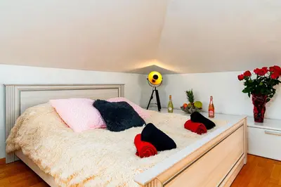 a bedroom with a bed with pillows on it at Bright Bohemian River in Prague