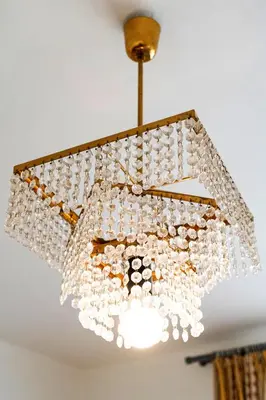 a chandelier hanging from a ceiling at Golden Heart Residence in Prague