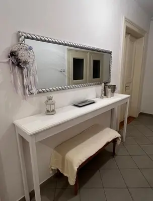 a bathroom with a white vanity with a mirror at Štěpánská noc A in Prague