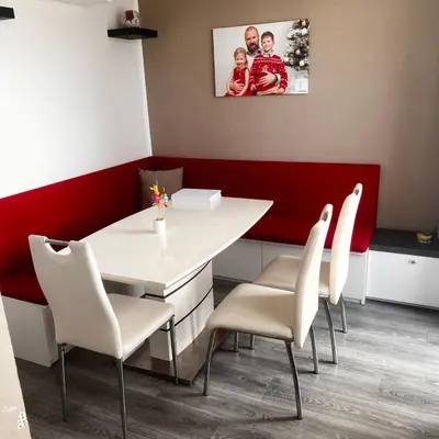 a dining room with a white table and white chairs at Big apartment in quiet location close to the center -ideal for families with kids in Prague