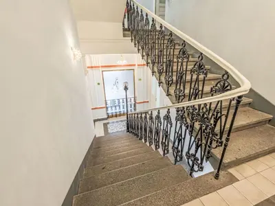 a staircase in a home with wrought iron railings at Apartment Čelakovsky-3 by Interhome in Prague
