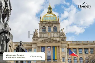a building with a tower on top of it at HOMELY I 32m2 Central loft I ELEVATOR I SELF CHECK-IN in Prague