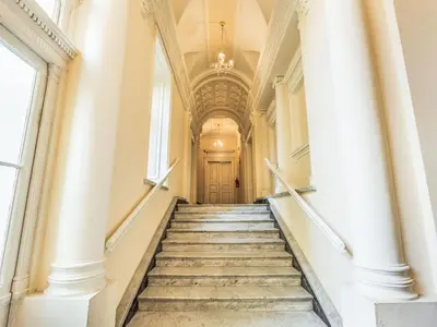 a staircase leading up to a building with a door at Apartment Washington-6 by Interhome in Prague