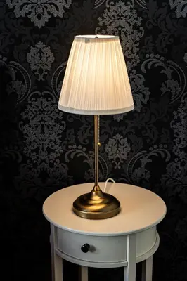 a table with a lamp on top of it at Hound Deluxe Suite in Prague