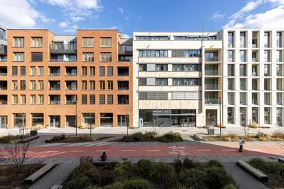 a group of buildings in front of a courtyard at Modern City Apartment in Prague