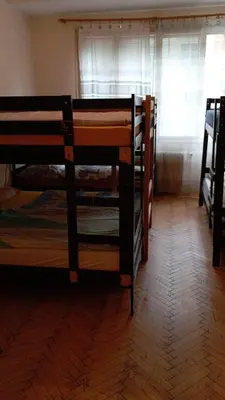 two bunk beds in a room with a window at Bed in shared dormitory near the city centre in Prague