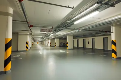 an empty parking garage with a long long hallway at Fortuna Garden I in Prague