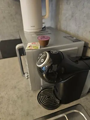a coffee maker sitting on top of a counter at Centre NEW modern apartment & parking near O2 arena in Prague