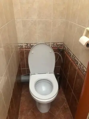 a bathroom with a white toilet in a room at Central cozy rooms Soukenická S35 in Prague