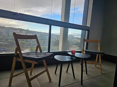 two chairs and a table in front of a window at Centre Design Suite O2 Arena - Parking-Balcony-big TV-Coffee, 24 7 Self Check-in in Prague