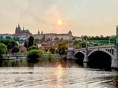 a bridge over a river with a city in the background at Apartment Čelakovsky-5 by Interhome in Prague