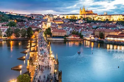 a view of a city from the river at night at Luxurious Studio at New Town By Wishlist Prague in Prague