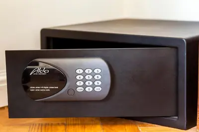 a black microwave oven sitting on top of a table at Templova Old Town Apartment in Prague