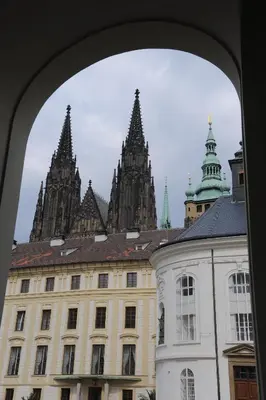 a view of a building from an archway at Císařka Apartments in Prague