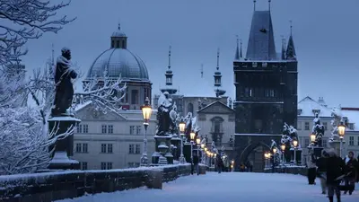 a city street covered in snow with buildings at City centre Apartment Prague by Michal&Friends in Prague