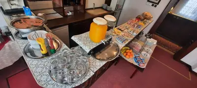 an aerial view of a kitchen counter with food and orange juice at Excellent Romantic in Prague