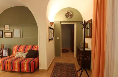 a living room with a couch and an archway at Mala Strana apartment 1 in Prague