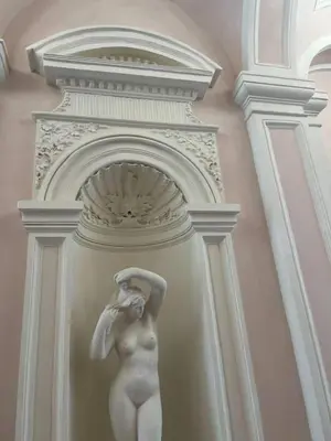 a statue of a woman standing in a wall at 2-Bed Apartment in Praha in Hřebečníky