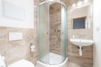 a bathroom with a shower and a sink at Brand new studio apartment #62 with free secure parking in the center in Prague