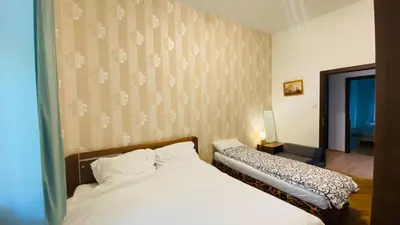 a white table with two potted plants on it at Hotel Apartment in Prague 2 Square in Prague