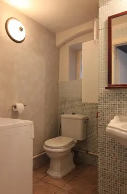 a bathroom with a toilet and a sink at 1 Bed Flat - Sleeps 3 - Courtyard - Wifi in Prague