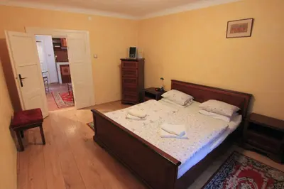 a bedroom with a bed with two towels on it at 1 Bed Flat - Sleeps 3 - Courtyard - Wifi in Prague