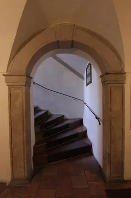 an archway with a staircase in a building at 1 Bed Flat - Sleeps 3 - Courtyard - Wifi in Prague